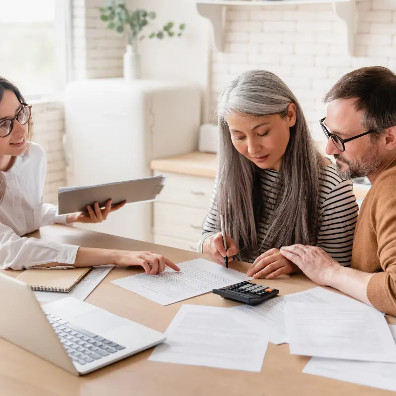 Richmond property owners discussing their sale with a real estate agent