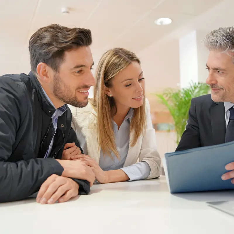 Property owners discussing their Toorak sale with a real estate agent