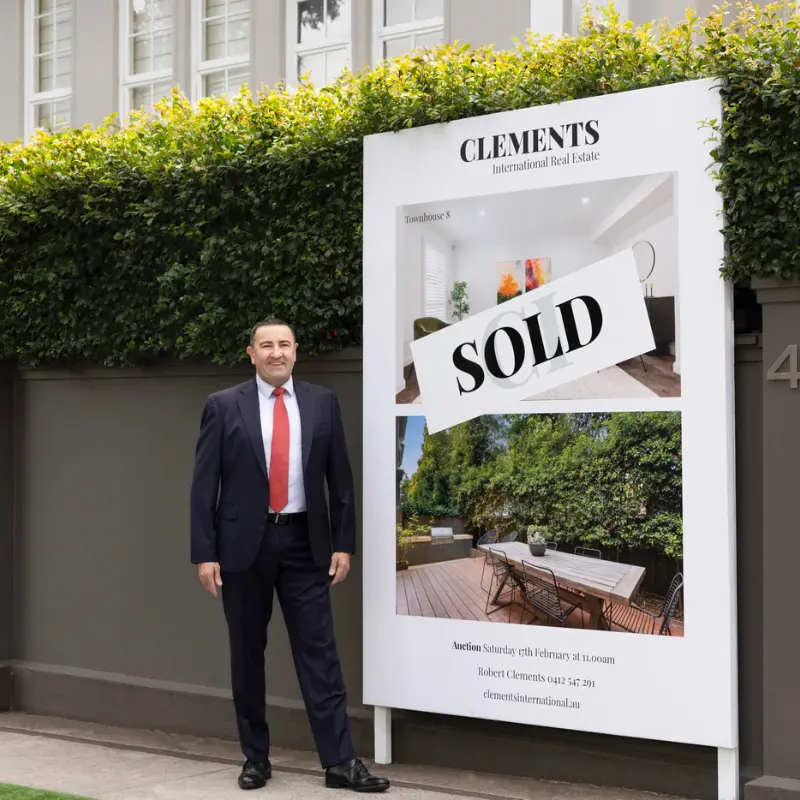 Robert Clements beside the sold property at 40 Grange Road, Toorak