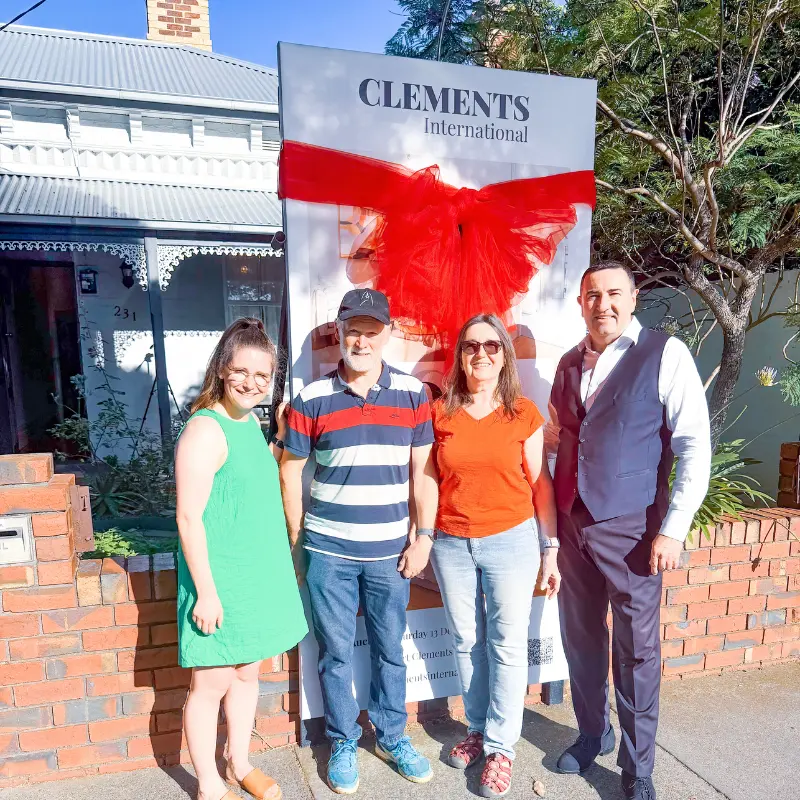Robert Clements of Clements International with Richmond property vendors and the buyer after a successful property sale.